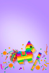 Obraz premium Pinata in the shape of a horse on isolated background. Rainbow-colored paper handmade Piñata toy for a birthday party Mexican style.