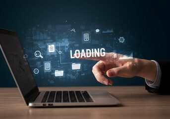 Loading data on laptop concept with hand touching screen for technology and internet use case, seo