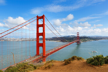 Golden Gate Bridge and skyline of San Francisco on a sunny day, San Francisco California USA. Viewing from Golden Gate view point on north side of bridge.