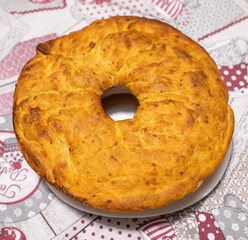 Neapolitan Tortano, a Savory Ring Shaped Cake, Resting on a Festive Tablecloth