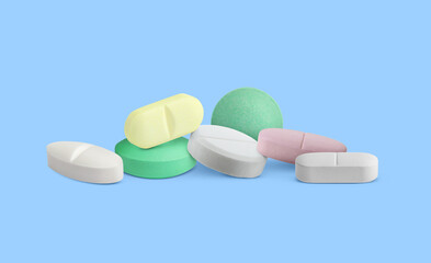 Different antibiotic pills on light blue background. Banner design