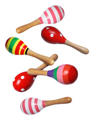 Toy maracas in air on white background. Child's musical instrument