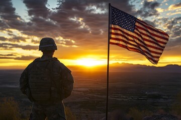American Soldier in Uniform Standing by U.S. Flag at Sunset for Memorial Day Tribute