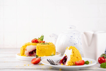 No-bake Upside Down Cheesecake, viral trendy version of classic Cheesecake New York with golden cookie crumbles, white cream cheese and berry jam layers, with fresh strawberry and mint on wooden table