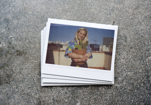 Collection of blank polaroid mockups on a textured surface