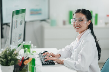 Scientists examining plant and algae samples in a modern laboratory, conducting pharmaceutical...