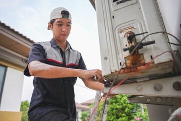 Technician Repairing Outdoor Air Conditioning Unit with Wrench, Close-Up of HVAC Maintenance and Repair Work, Professional Air Conditioner Installation or Service in Progress