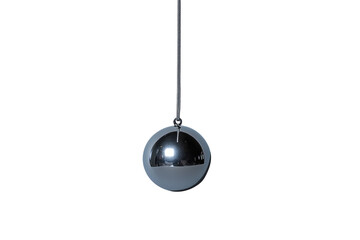 A reflective metallic sphere hangs from a thin cord against a black backdrop