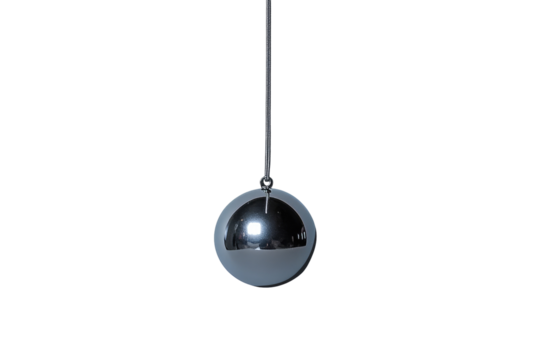 A reflective metallic sphere hangs from a thin cord against a black backdrop