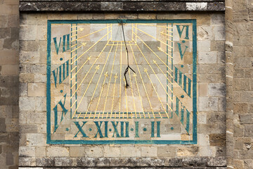 Sundial at the facade of Chichester Cathedral, West Sussex, UK