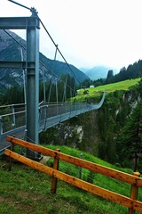 Austrian Alps - view of the rope suspension bridge high above the Höhenbachtal near the town of Holzgau in the Lechtal Alps