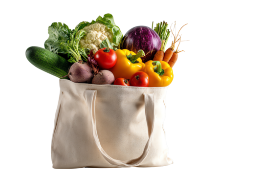 Assorted fresh vegetables in a canvas bag, white isolate background