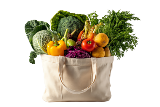 Fresh vegetables in a reusable bag, isolated on a white background.