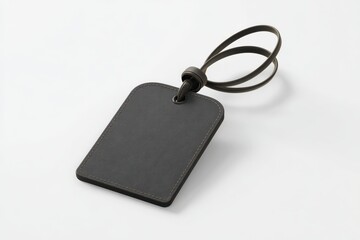 Fototapeta premium Dark gray luggage tag with a blank label, ready for personalization.