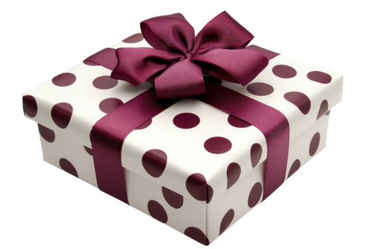 A gift box with polka dots and a ribbon