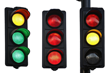 Three traffic signals displaying red, yellow, and green lights