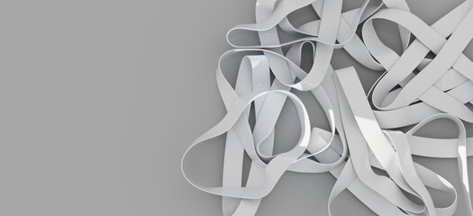White rubber bands tangled on gray background. Abstract texture.
