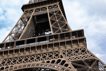 Stunning detail shot of the Eiffel Tower's structure.  Perfect for travel, architecture, and France-themed projects.