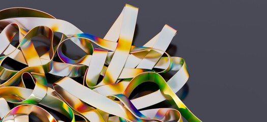 Close-up of colorful, metallic ribbons intertwined.  Abstract, modern, and artistic.