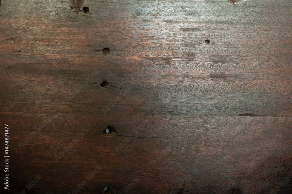 Poster high-resolution image of dark brown wood grain with visible knot holes. perfect for backgrounds or t