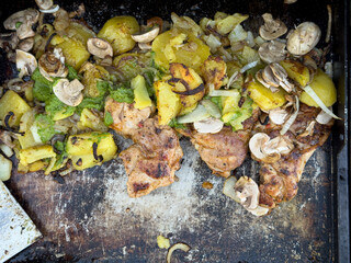 Delicious grilled chicken breast with roasted potatoes, mushrooms, and herbs. Perfect summer meal!