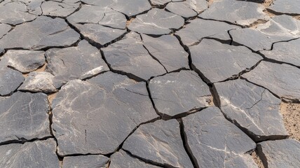 Cracked dry basalt stone background image suitable for textures or design projects.