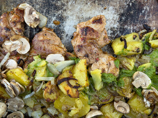 Delicious grilled chicken, roasted potatoes, mushrooms, and a vibrant herb sauce.
