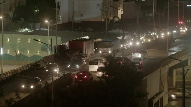 Traffic moves slowly through the city of Addis Ababa, Ethiopia at night.