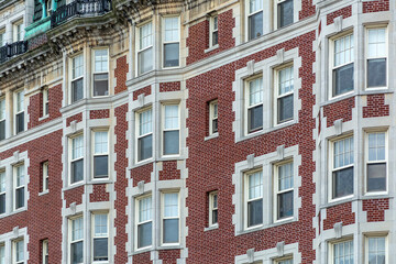 Obraz premium Elegant red brick apartment building with classical window details in Boston, Massachusetts, USA 