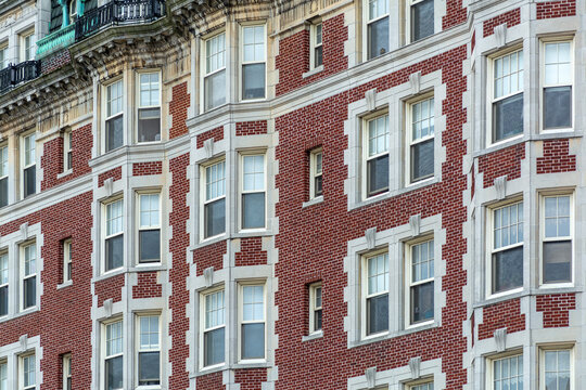 Elegant red brick apartment building with classical window details in Boston, Massachusetts, USA
