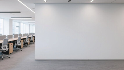 Bright, modern open plan office with minimalist wooden desks arranged in rows, creating a clean, organized, and functional workspace.

