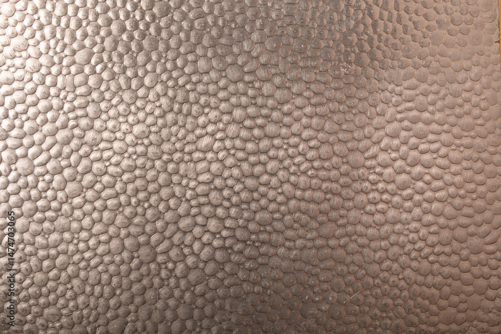 Poster High-resolution image of a metallic surface with a pebble texture. Ideal for backgrounds and design projects.