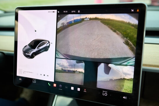 Berlin, Germany - May, 4 2024: Tesla Model 3 54 kWh Standard Range Plus 2019 Detailing of Tesla Model 3 interior. Dashboard with Tesla screen.