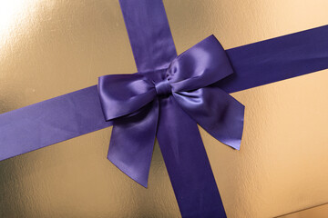 Luxury gift packaging,gold box with purple ribbon. Perfect for holidays, birthdays, or special...