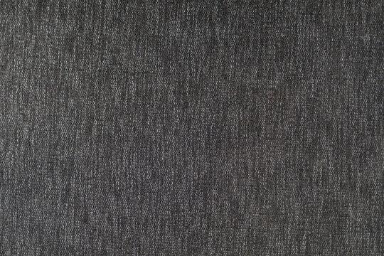 High-resolution image of dark gray textured fabric. Perfect for backgrounds or textile designs.