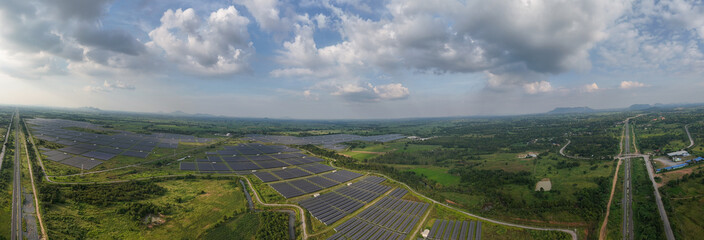 Aerial bird view photo of photovoltaic power station also known as a solar park is large-scale...