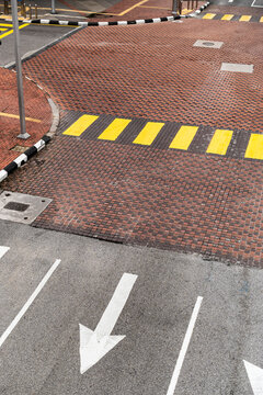 Urban road intersection with arrow and crosswalk lines in Brickfields Kuala Lumpur, Malaysia