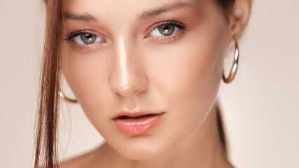 Closeup Of Woman With Glossy Lips And Radiant Skin In Beauty Concept