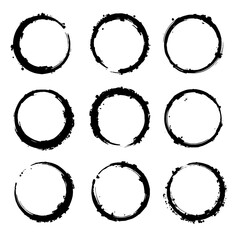 Black ink brush strokes in circles, grunge texture vector set isolated on a white background. Hand drawn circular shapes with round textures and stripes
