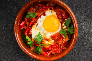 Fried egg tomatoes shakshuka vegetable dish appetizer fresh delicious gourmet food background on the table rustic food top view copy space vegetarian  food