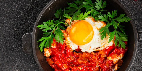 Fried egg tomatoes shakshuka vegetable dish appetizer fresh delicious gourmet food background on the table rustic food top view copy space vegetarian  food