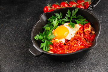 Fried egg tomatoes shakshuka vegetable dish appetizer fresh delicious gourmet food background on the table rustic food top view copy space vegetarian  food