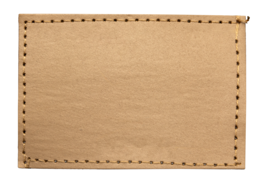 Empty worn leather patch on blue jeans on a white background. Empty space for writing. Blank leather jeans label