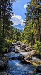 Serene mountain stream flows through lush forest, sunlit rocks and distant peaks visible