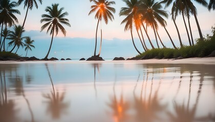 Fototapeta premium A picturesque tropical beach scene at sunset, with palm trees reflected in the calm water.