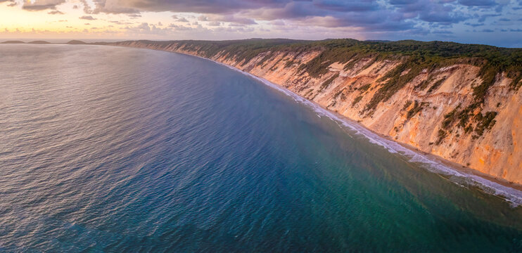 Rainbow Beach, Queensland Australia, aerial drone view coloured sand cliffs, beach and ocean, holiday destination