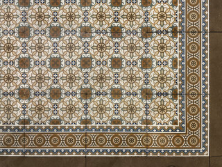 Colonial heritage patterned tiles in random floral, star, ornamental, engraving, and other abstract patterns. Handmade colonial tiles, or old heritage tiles in brown and beige tone. Seamless texture.