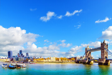 Fototapeta premium View of the financial district of the City of London and Tower Bridge is a road bridge over the River Themes.