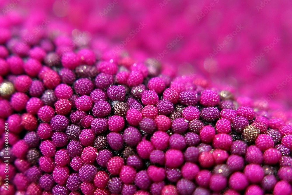 Poster textured fabric featuring vibrant pink and purple beads creating a visually striking design