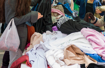 people looking for deals in a flea market